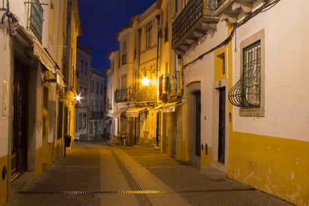 Night street of Evora city with lantern lights and blue night skyの写真素材