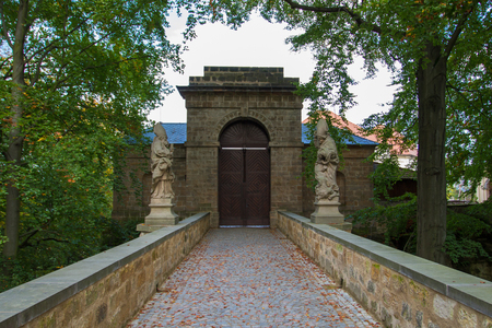 Closed castle door with statues on each sideの写真素材