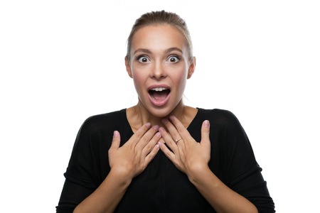 Portrait of surprised beautiful blond woman on white backgroundの写真素材