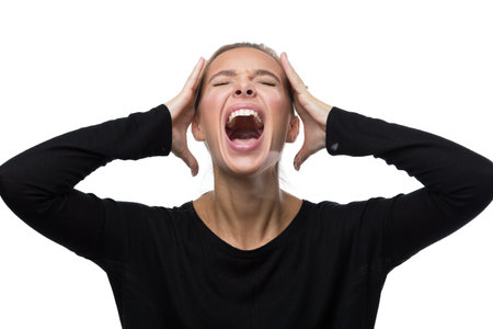 Portrait of stressed blond woman on white background