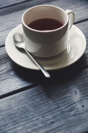 Cup of tea on the dark Wooden Tableの写真素材