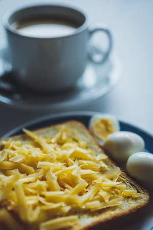 Sandwich toast bread for breakfast with cheese and eggs, close-up shot