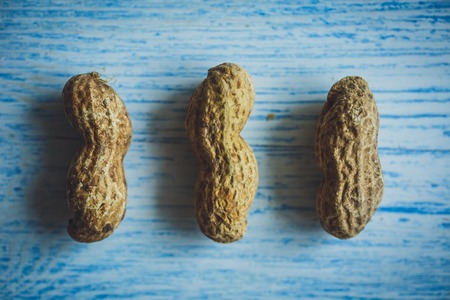 Fresh peanuts in shell top view backgroundの写真素材