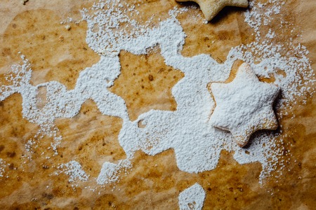 Cookie on a baking pan covered with powdered sugar.の写真素材