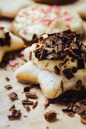 Colorful cookie with chocolate on the top. Vertical studio shot.