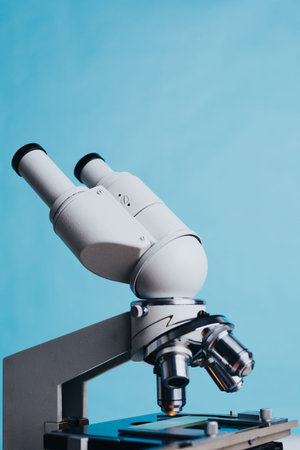 Powerful scientific laboratory microscope with multiple lenses.
