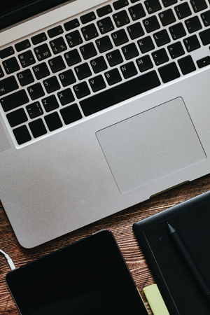 Top view of the table graphic designer workplace with laptop and tabletの写真素材