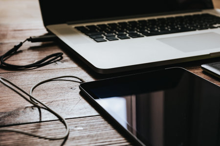 Top view of the table graphic designer workplace with laptop and tablet