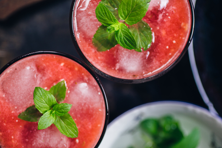 From above view of two glass of red smoothie with iceの写真素材