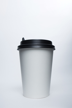 Mockup image of paper cup with cap on clean bacgroundの写真素材