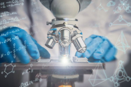 Close-up shot of microscope with metal lens. Chemical formulas effects