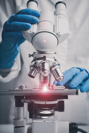 Close-up shot of microscope with metal lens.