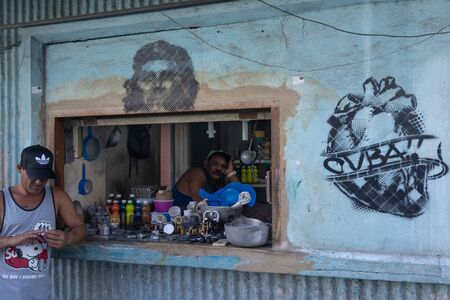 Havana, Cuba - November 11, 2018: Two men in a shop on the street in Old Havana, the Capital City of Cubaのeditorial素材