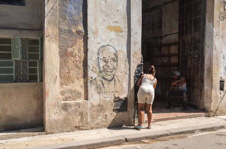 Havana, Cuba - November 11, 2018: A man and a woman speaking on the street in Old Havana, the Capital City of Cubaのeditorial素材