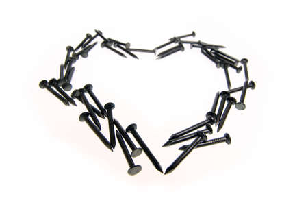 Heart Macro of nails isolated on white backgroundの写真素材