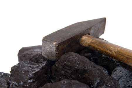 hammer and coal, carbon nugget isolated on white background