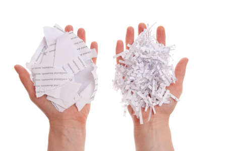 Shredded paper, security white pile in hand
の写真素材