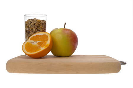 chopping board and fruit isolated on a whiteの写真素材