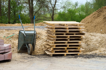 stack of wooden pallets  Barrow at an outdoor construction site の写真素材