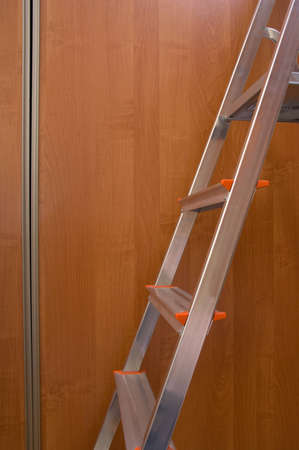 luminium ladder on door wardrobe background の写真素材