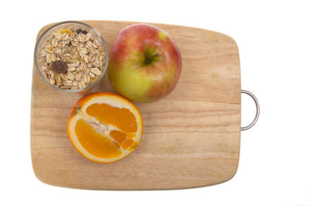 chopping board and fruit isolated on a whiteの写真素材
