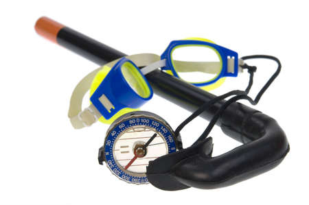 Tourist compass, swimming goggles,  snorkel isolated on a white backgroundの写真素材