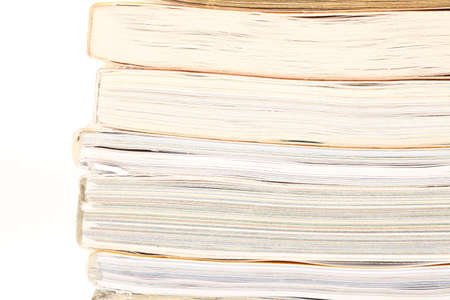 stack of opened magazines isolated on whiteの写真素材