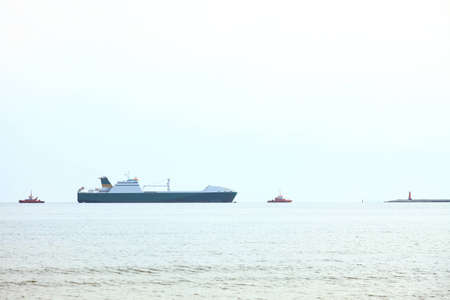 A large cargo ship at sea outdoorの写真素材