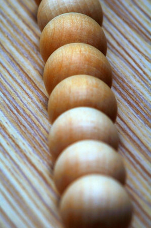 Wooden balls on a zebrano texture