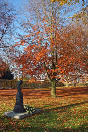 bronze statue of Holy Mary and beech tree in Tilburg, Netherlandsの写真素材