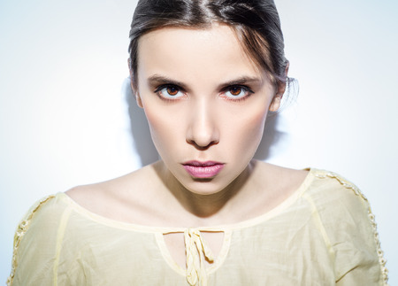 A portrait of woman on pastel background.の写真素材