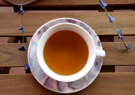 Tea in the garden, teacup from above on the tableの写真素材