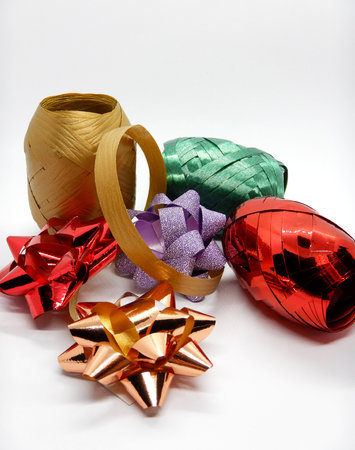 Several bows and ribbons, present ornaments on white backgroundの写真素材
