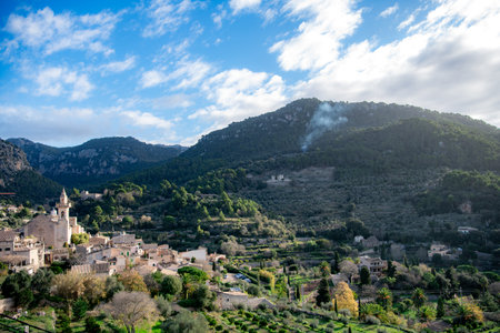 View of the town of Valldemossa, Mallorca, Spain from above with mountains in the backgroundの写真素材