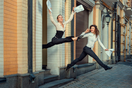 Girls happily run out of office in signing the contract の写真素材