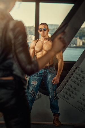Bodybuilder with glasses in a dangerous situation they want to kill him の写真素材
