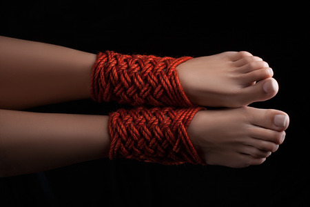 Shibari pattern on two legs female closeup.の写真素材