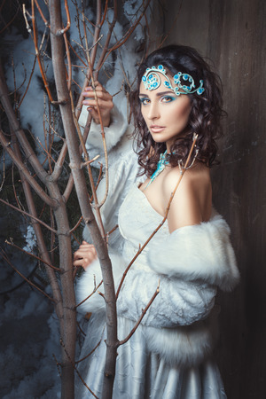 The girl on the forehead jewelery she in a white coat.の写真素材