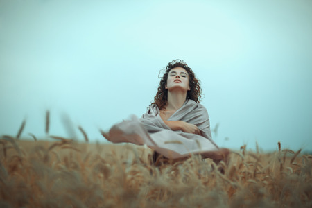 Portrait of a girl in a wheat field.の写真素材