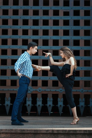Girl in a passionate dance put her foot on his chest guy.  This dance is very passionate and hot. See more photos of this series.の写真素材