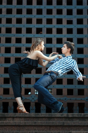 Young couple dancing the tango. They play emotions. See more photos of this series.の写真素材