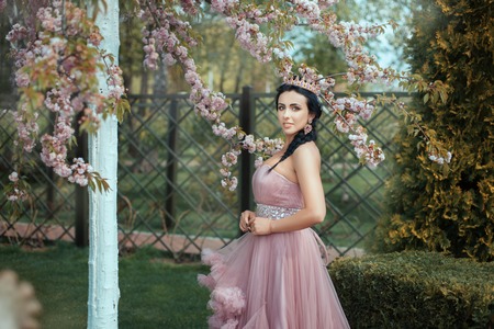 Queen in the garden among the blooming trees in the spring.の写真素材