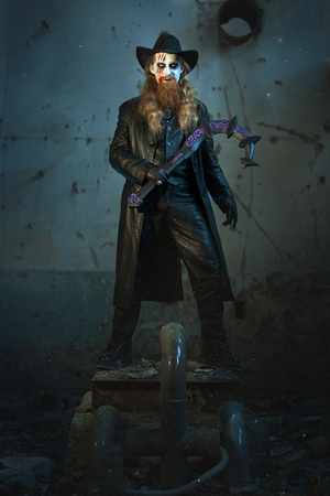 Terrible and evil man, in his hand a sickle to kill.の写真素材