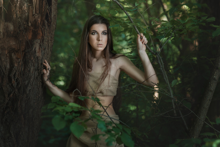 European woman lives in the woods like a savage.の写真素材