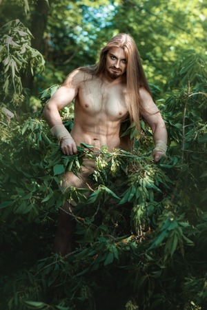 European man living in the woods like a wild people.の写真素材