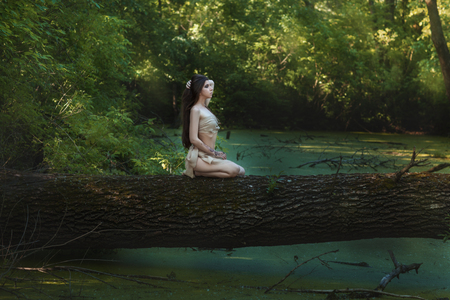Intelligent woman living in the forest like a wild people.の写真素材