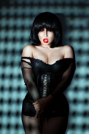 Vulgar woman with her mouth open and bright red lips.の写真素材