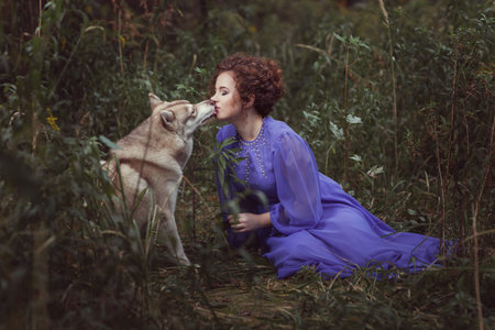 Dog tongue licking the girl's face, they are in the fairy forest.