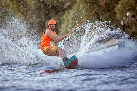 Extreme sport for men, water skiing on the board.の写真素材