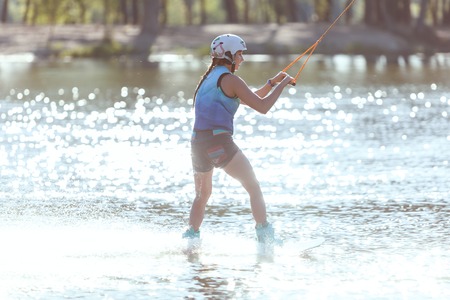 Woman skiing on water, summer fun and sports.の写真素材